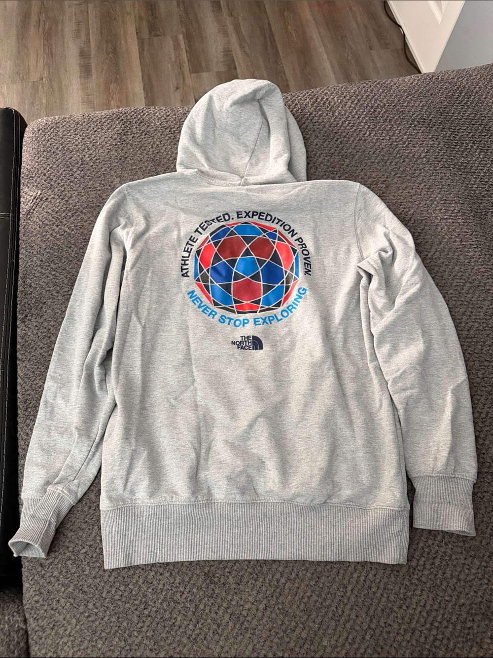 The North Face Light Gray Hoodie with Red & Blue Globe Graphic